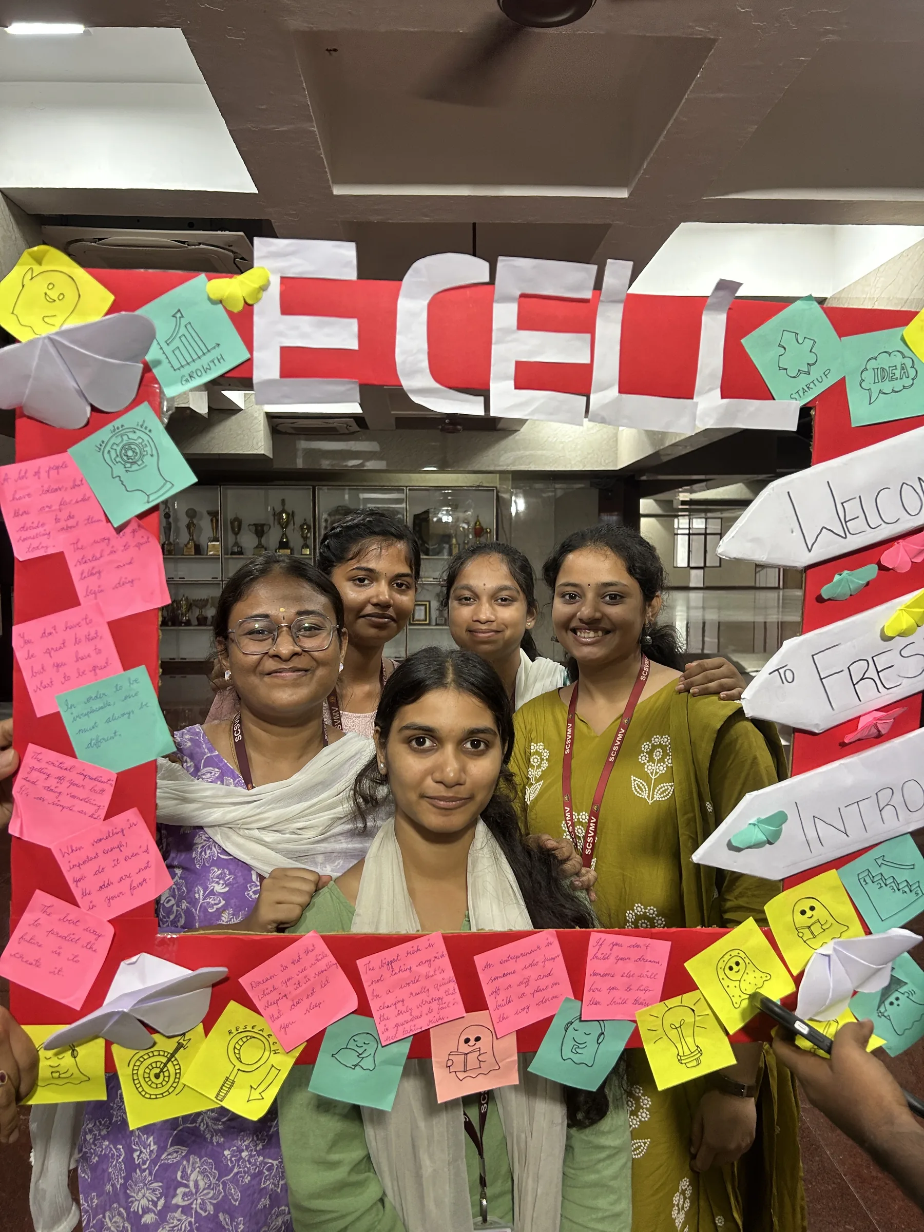Student organisers posing inside a handmade E-Cell photo frame