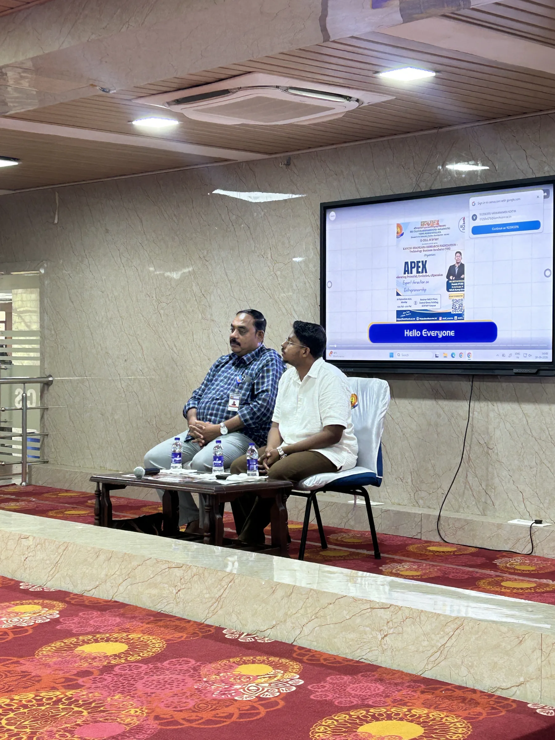 The APEX guests seated on stage as the session begins