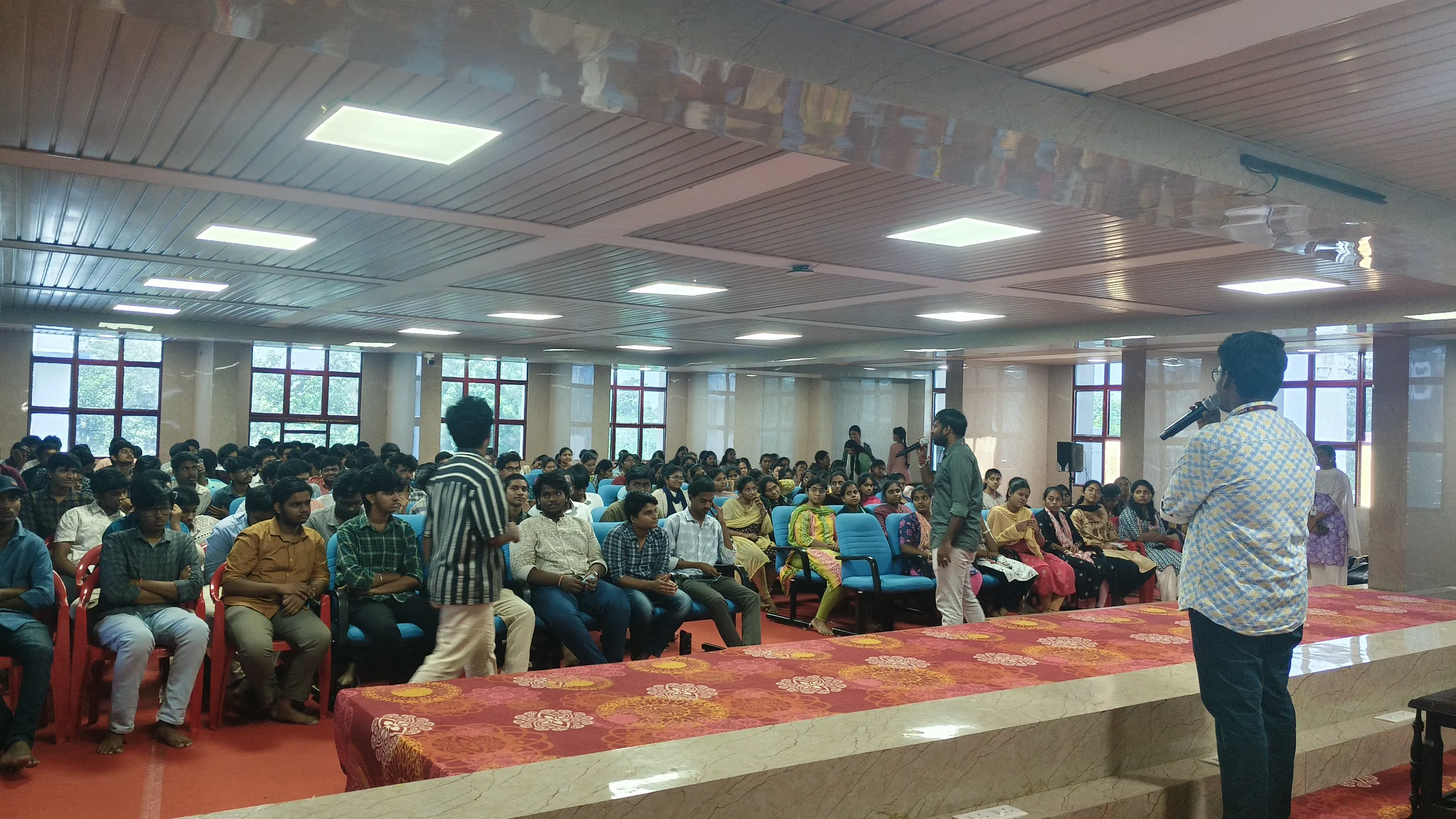 Student hosts leading an interactive exchange with the Freshie Intro audience